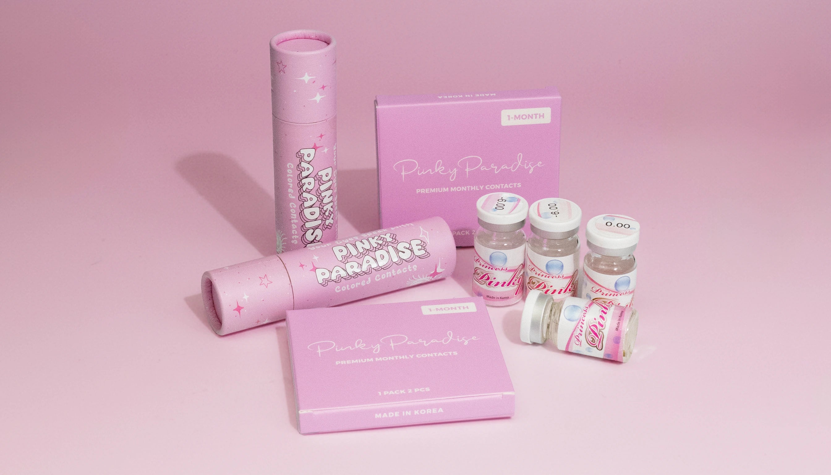 Pink Paradise skincare products on a pink background
