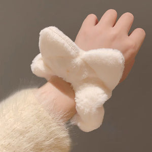 soft and fluffy scrunchie on a wrist as a cute accessory