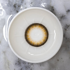 Subtle enlarging brown contact lenses