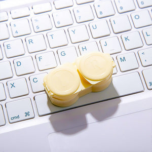 Pastel yellow portable contact lens case 