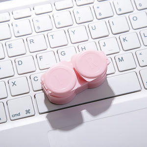 Pastel pink contact lens case for travel