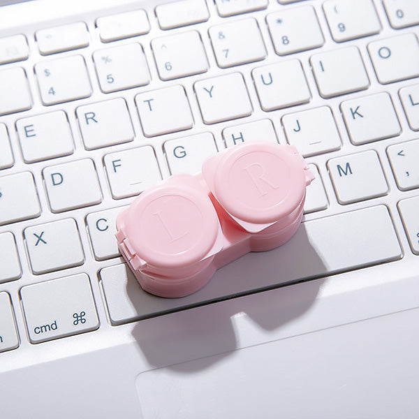 Pastel pink contact lens case for travel