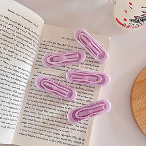 violet or purple contact lens tweezers and applicator