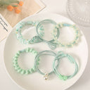 Fairycore-inspired pastel floral hair ties in mint green color 