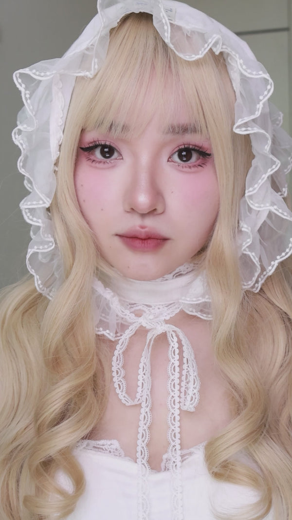 Model trying Aura Bloom Bluebell Topaz Colored Contact Lenses