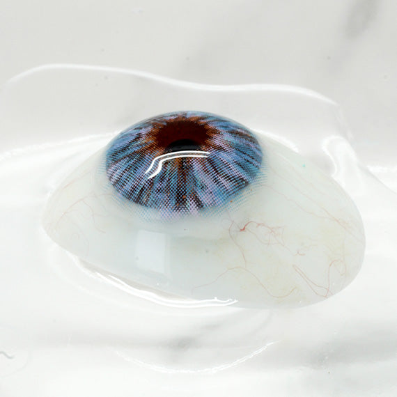 Princess Pinky Mojo Blue Color Contacts on display eye 