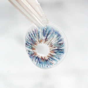 Princess Pinky Mojo Blue Colored Contacts on tweezer