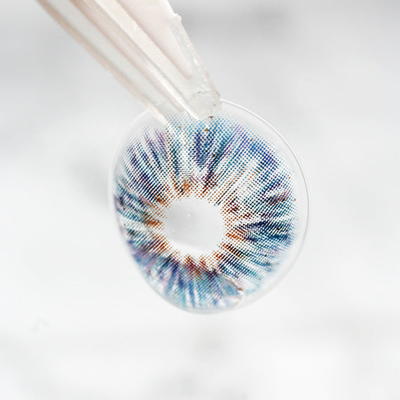 Princess Pinky Mojo Blue Colored Contacts on tweezer