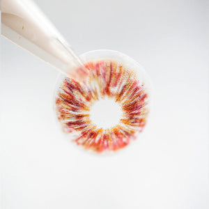 Princess Pinky Mojo Pink Colored Contacts on tweezer