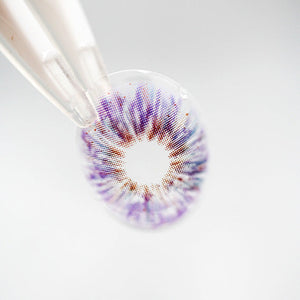 Princess Pinky Mojo Violet Colored Contacts on tweezer